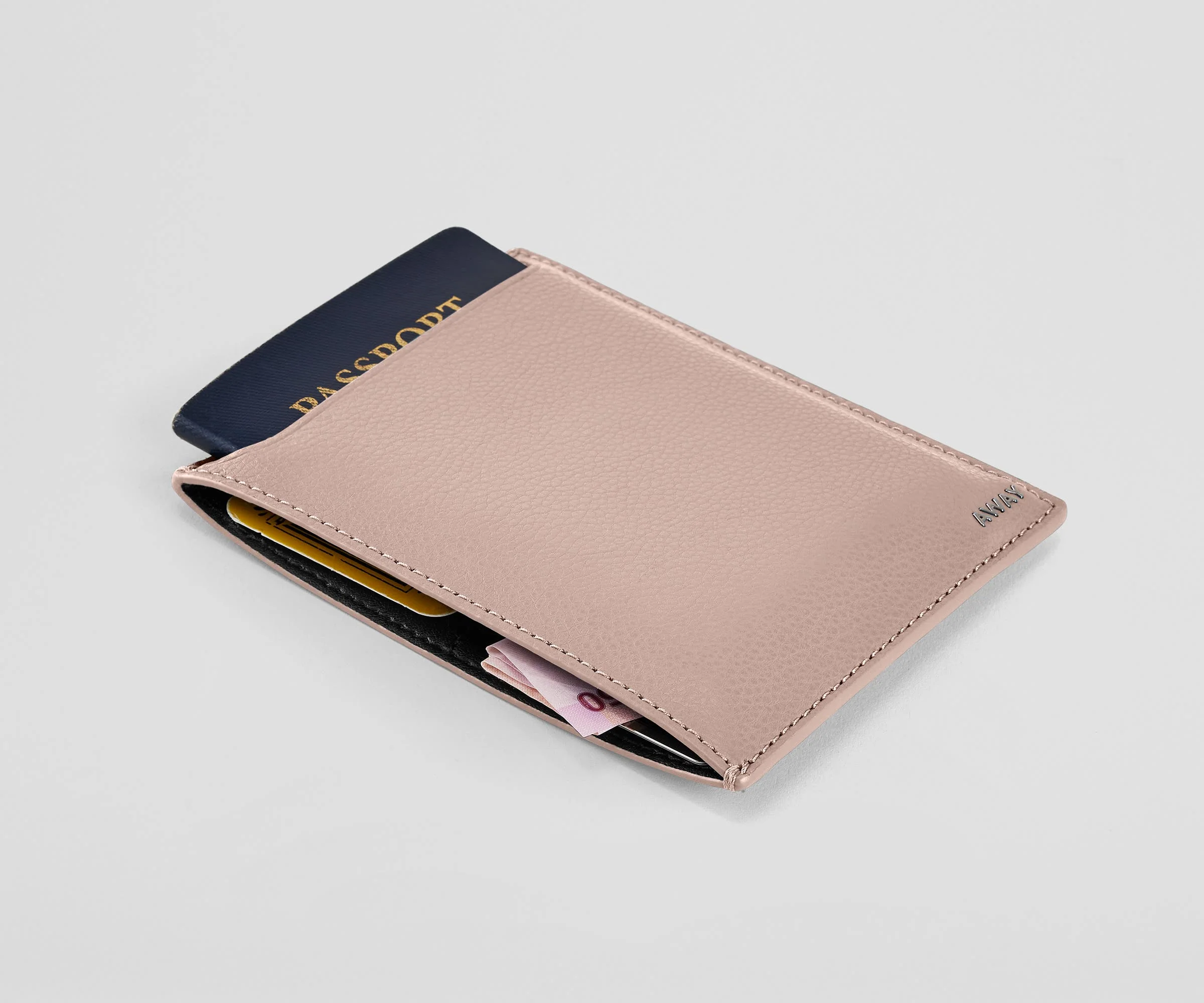 Passport wallet packed with a passport, money, and credit cards