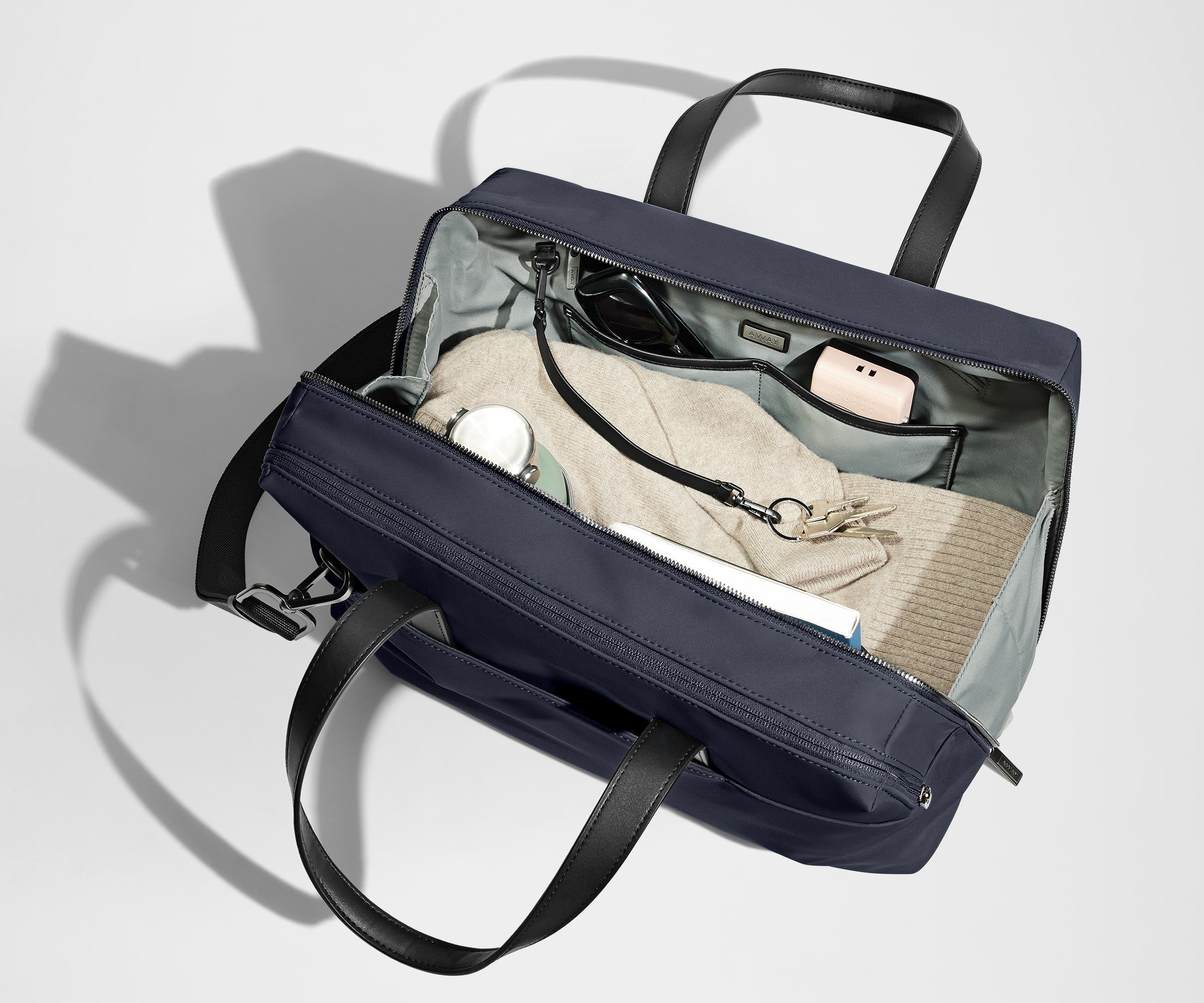 A pair of keys attached to the key leash in the main compartment